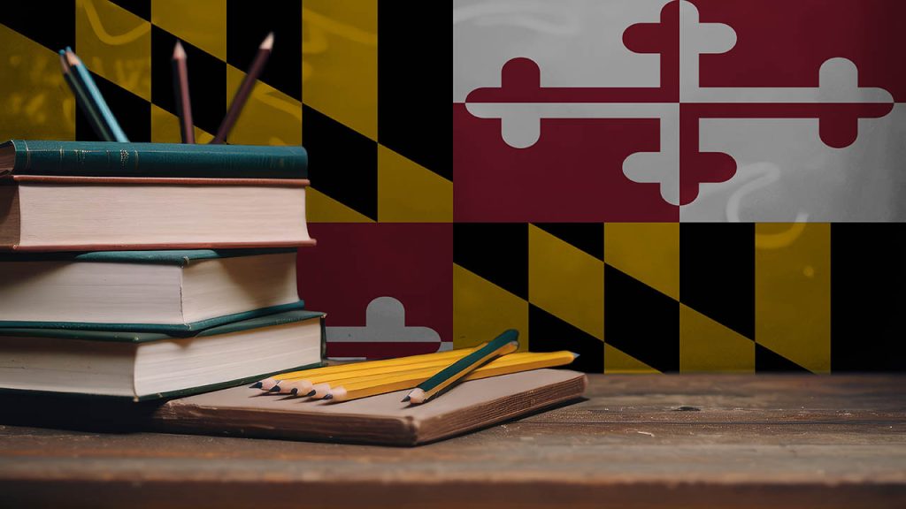 Books and pencils in classroom on the background of the Maryland flag. Concept of education, back to school